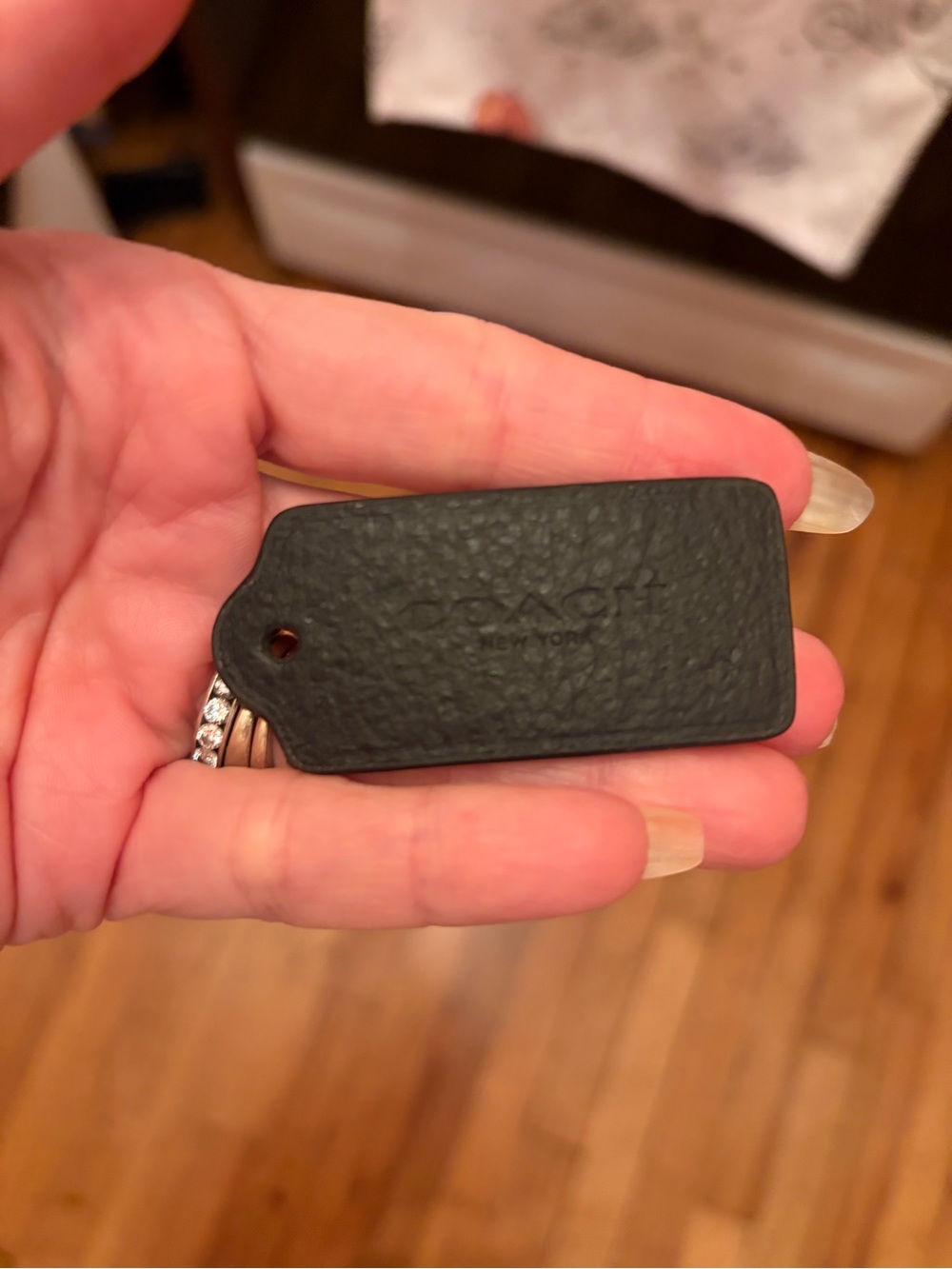 Coach black leather bag tag